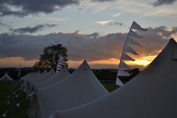 Bell tents being used at a festival