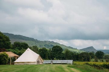 Bell Tent in open field with grey skies in the countryside
