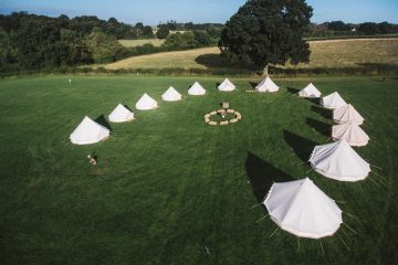 Large group of bell tents for family and friend gatherings